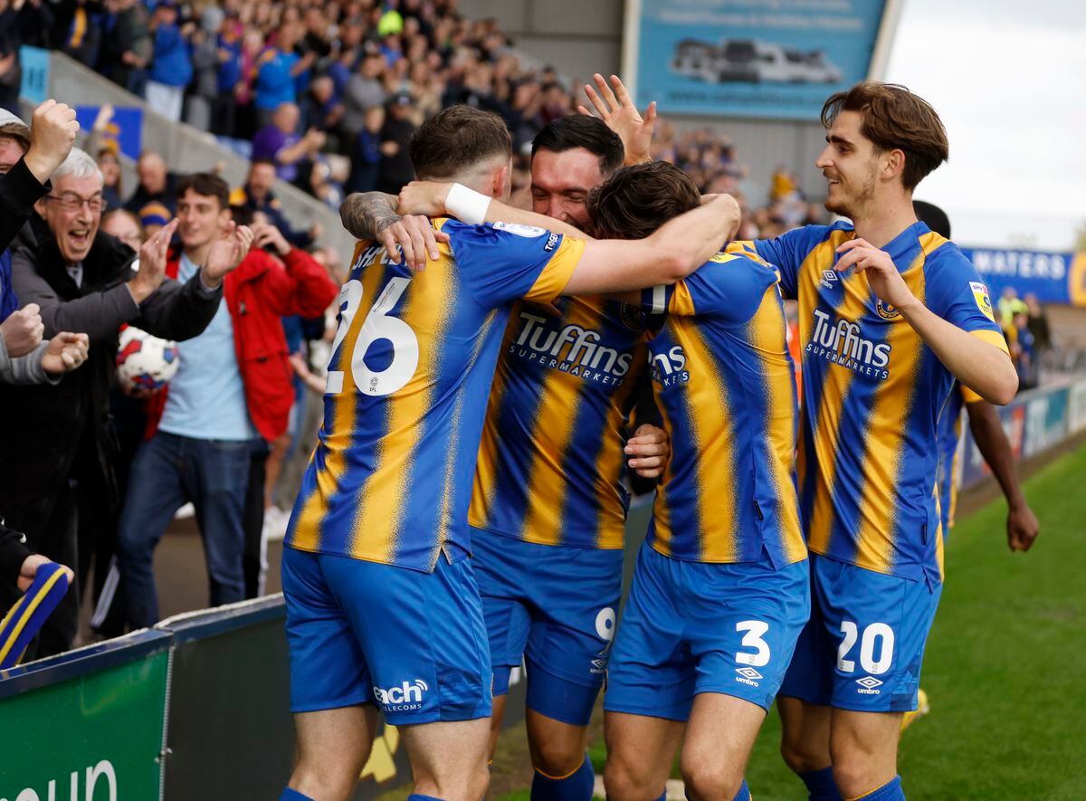 Ryan Bowman of Shrewsbury Town celebrates with his team mates after scoring a goal to make it 2-1.