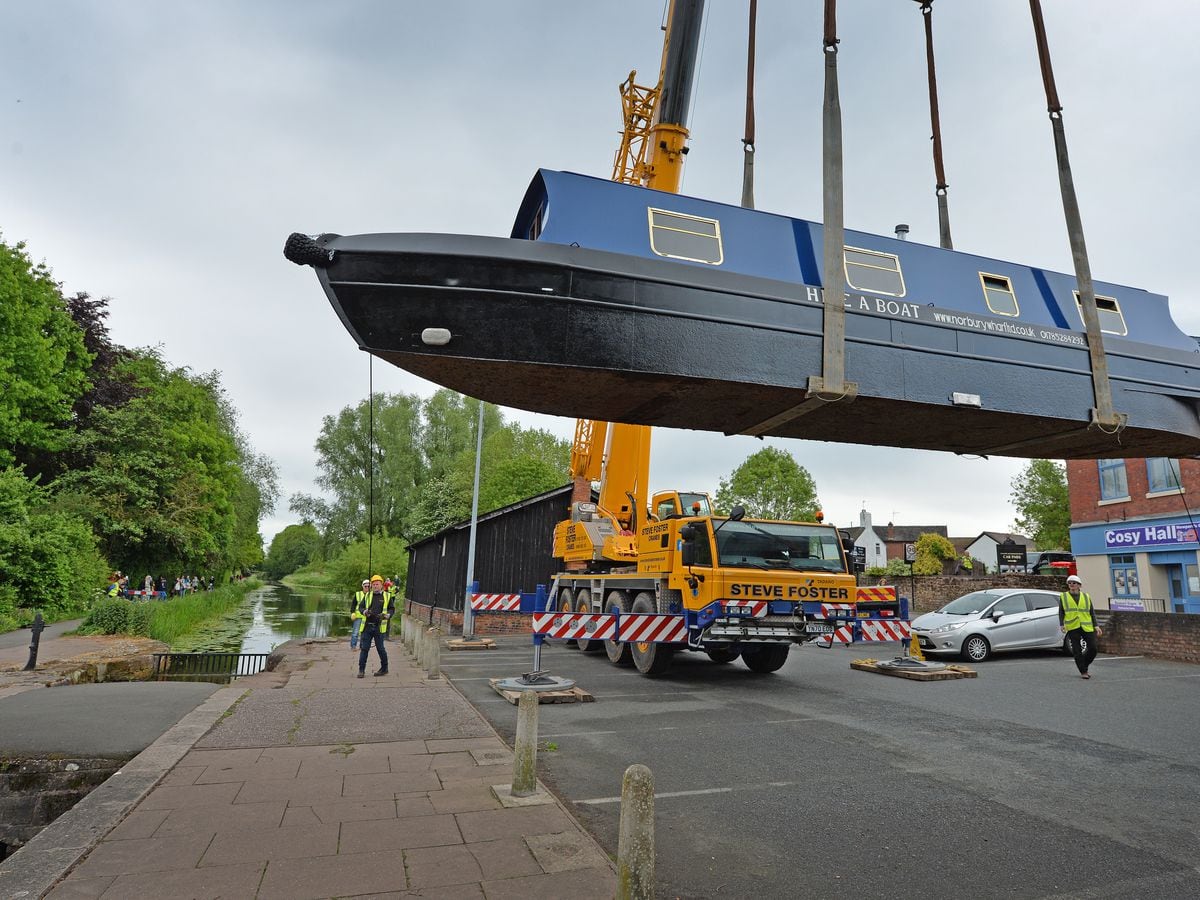 The boat being lifted into place on Newport's canal