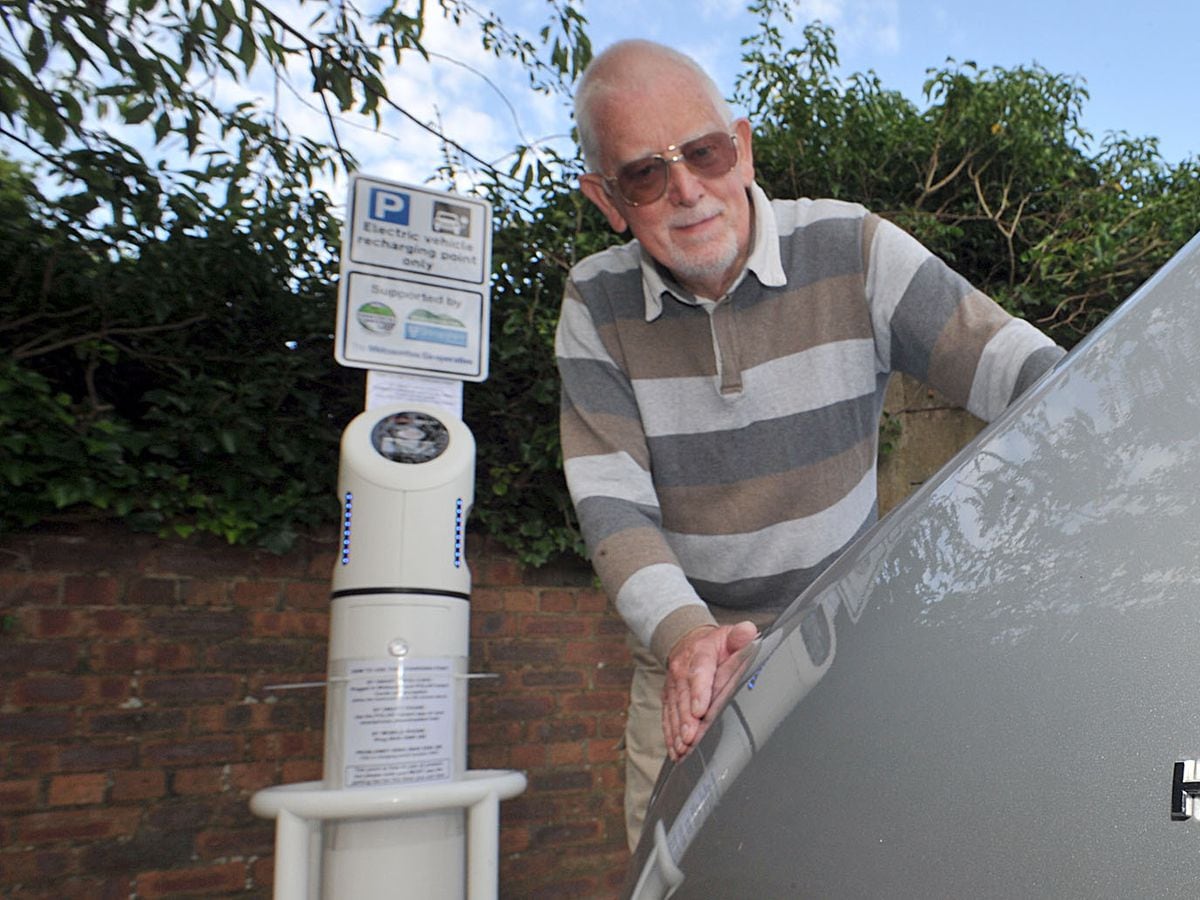 SOUTH WORDS REPORTERS. Jon Cooke with the new electricity charging station at the Co-op in Church Stretton.PIC BY MARK BOOTH 29/7/14.