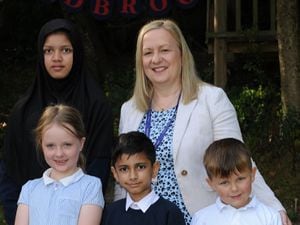 Emma Thelwell with Radbrook Primary School children Mehreen, Martha, Daiyan and Casper.