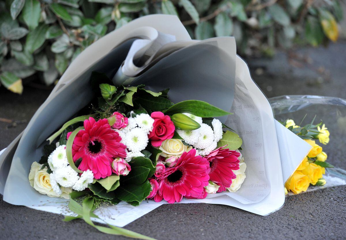 Flowers at the scene in Farmers Gate on Sunday morning