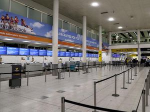 Empty Thomas Cook check-in desks at Gatwick Airport