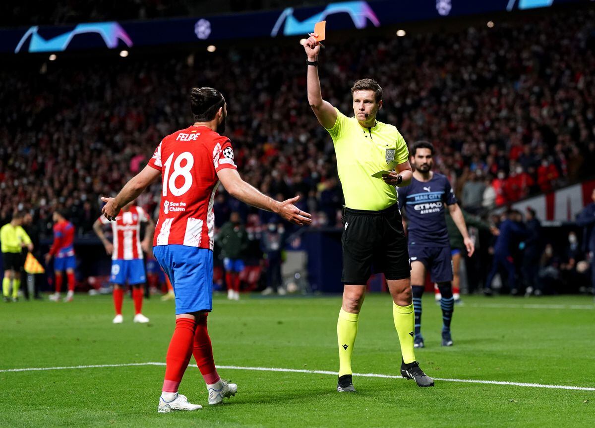 Atletico Madrid's Felipe receives a red card from referee Daniel Siebert during the UEFA Champions League quarter final, second leg match at the Wanda Metropolitano Stadium, Madrid. Picture date: Wednesday April 13, 2022.