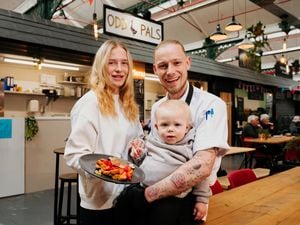 Matthew Palin and Wioleta Odrakiewicz with son, River at their new street food stall in Wellington Market, Odd Pals