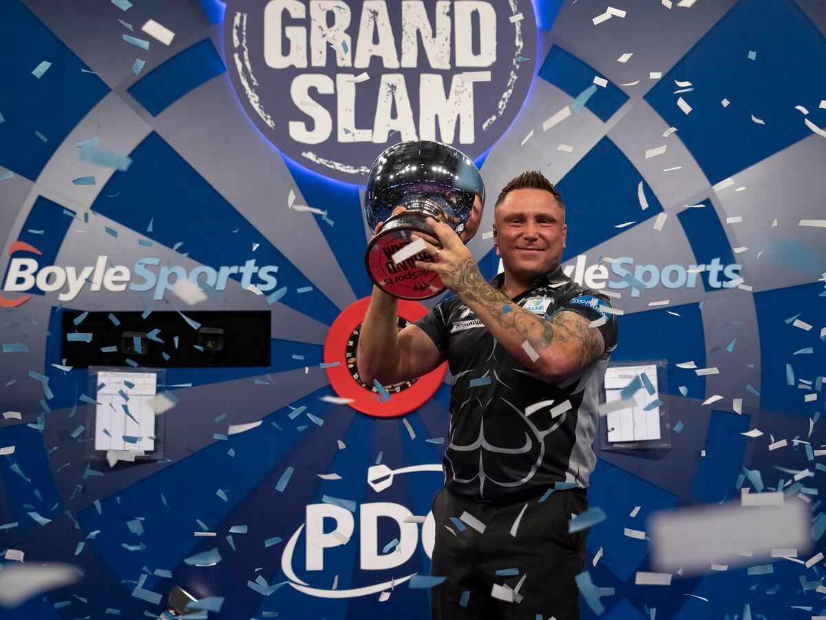 Gerwyn Price celebrates retaining his Grand Slam of Darts title (Picture: Lawrence Lustig)