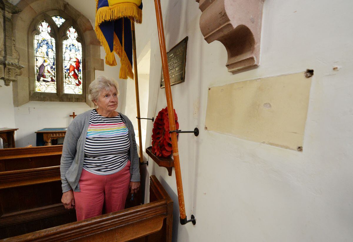 Church warden Janet Brick at the spot the plaque was stolen from