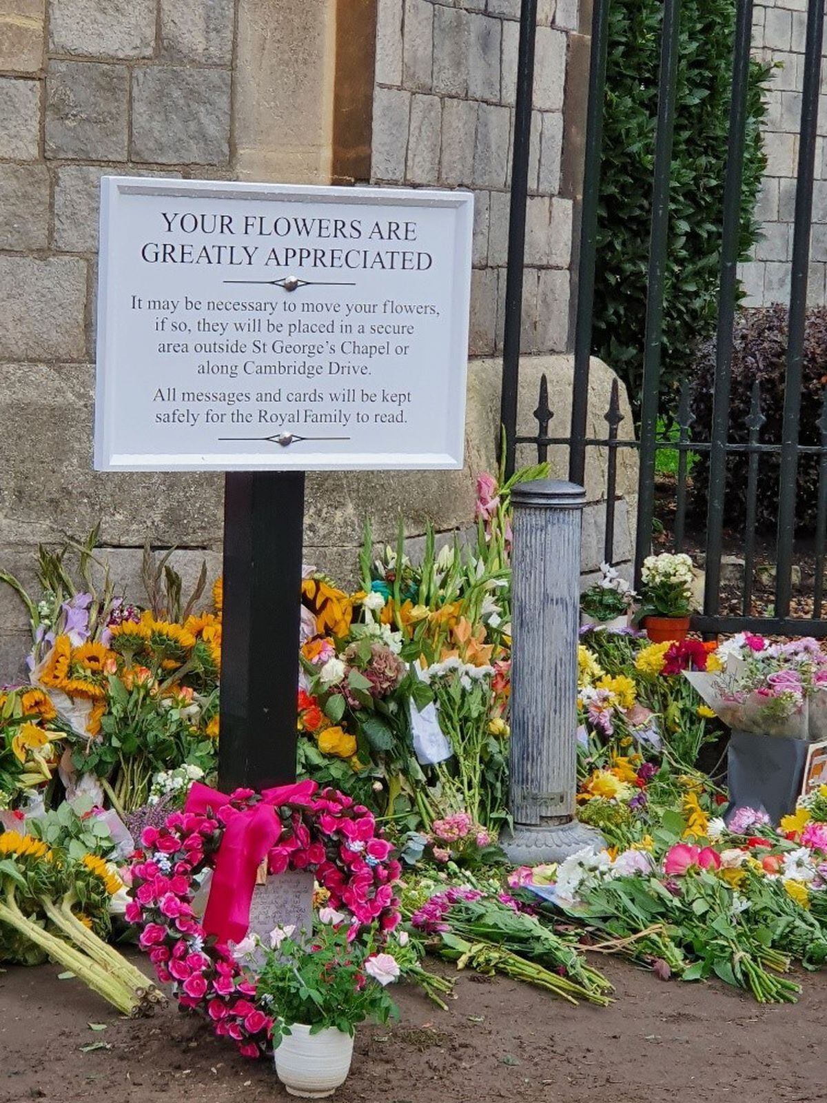 Flowers laid outside Windsor Castle to mark the death of the late Queen Elizabeth II. Photo: Dawn Hughes