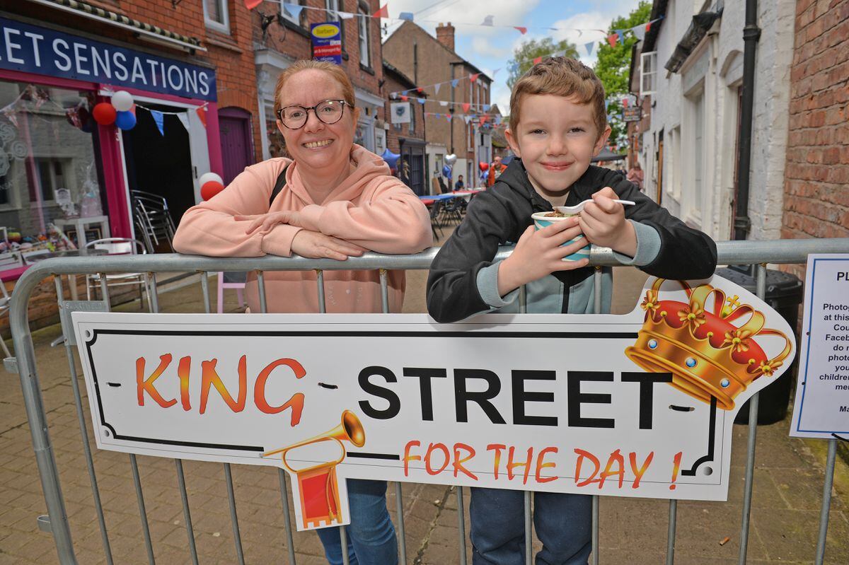 Tracey Griffiths and Jack Pardy, 7 celebrate in Market Drayton on Queen Street - aptly renamed King Street for the day