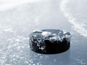 A hockey puck on the ice