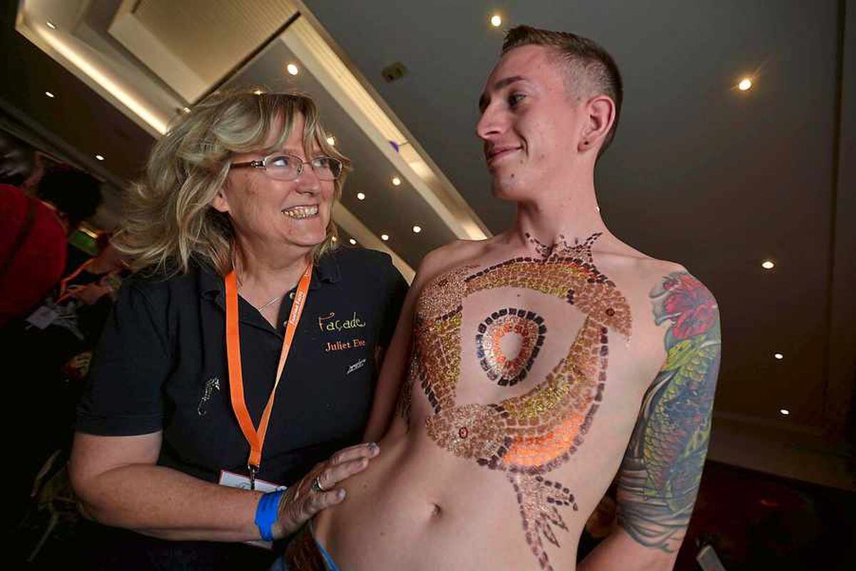 Body artist Juliet Eve gets down to work on Telford's Simon Phillips