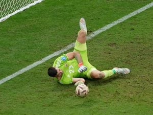 Emiliano Martinez saves from FranceÃ¢ÂÂs Kingsley Coman, not pictured, in the World Cup final penalty shoot-out