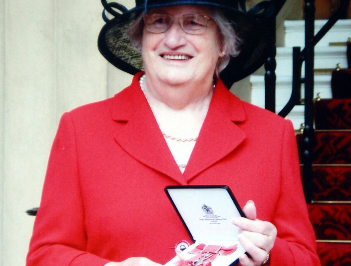 Margery with her MBE at Buckingham Palace.