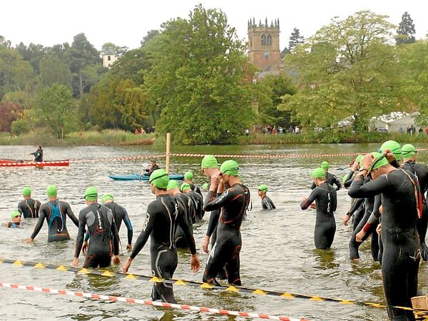 Swimmers enter Ellesmere Mere for the Shropshire Triathlon which is a world championship qualifying event. WITH WORDS FOR NEWS AND SPORT.. PIC BY SIMON WILLIAMS 5/6/11