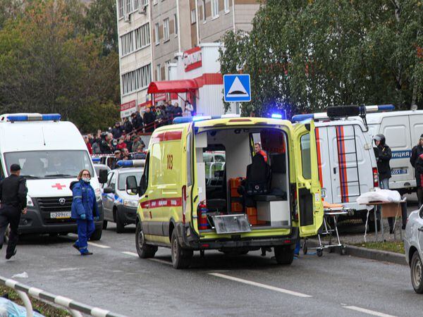 Police and paramedics work at the scene of a shooting at school Number 88 in Izhevsk, Russia