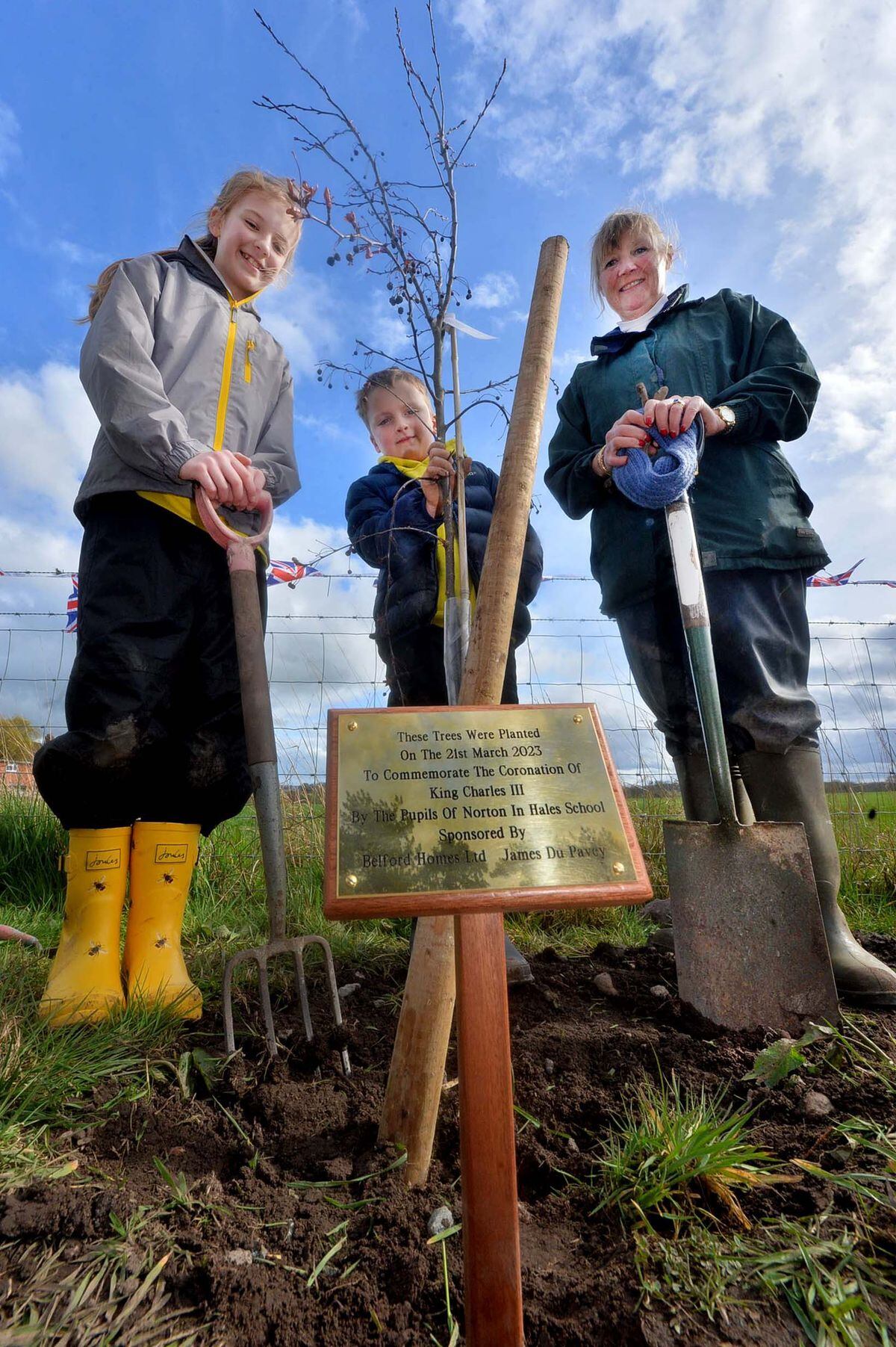 Norton in Hales pupils Evie and Jacob with Sarah Moulson, Chair of the In Bloom group, at the tree planting.