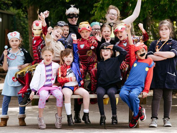 Tommy in the middle front as Iron Man with Lilleshall Primary School pupils from years 1 and 2