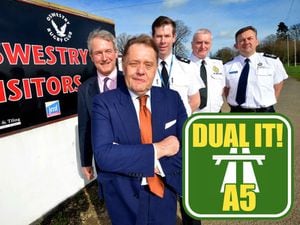 Rod Hammerton, chief officer of Shropshire Fire and Rescue Service, right, with Owen Paterson left, roads minister, John Hayes and other emergency service leaders.
