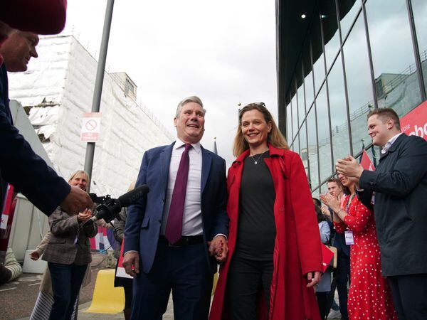 Labour party leader Sir Keir Starmer and his wife Victoria are greeted by party supporters as they arrive at the Pullman Liverpool
