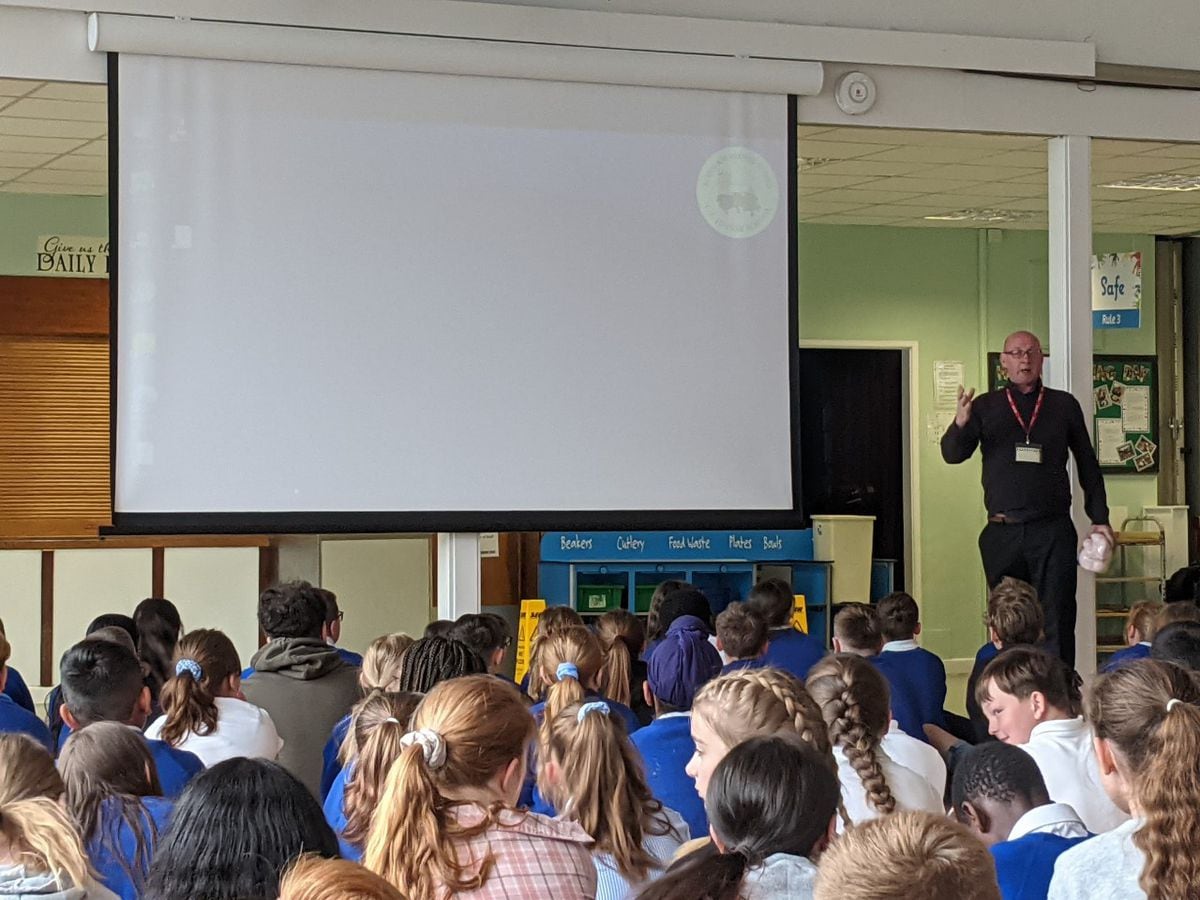 Steve Barras addresses pupils at Wrockwardine Wood C of E Junior School on the benefits of saving