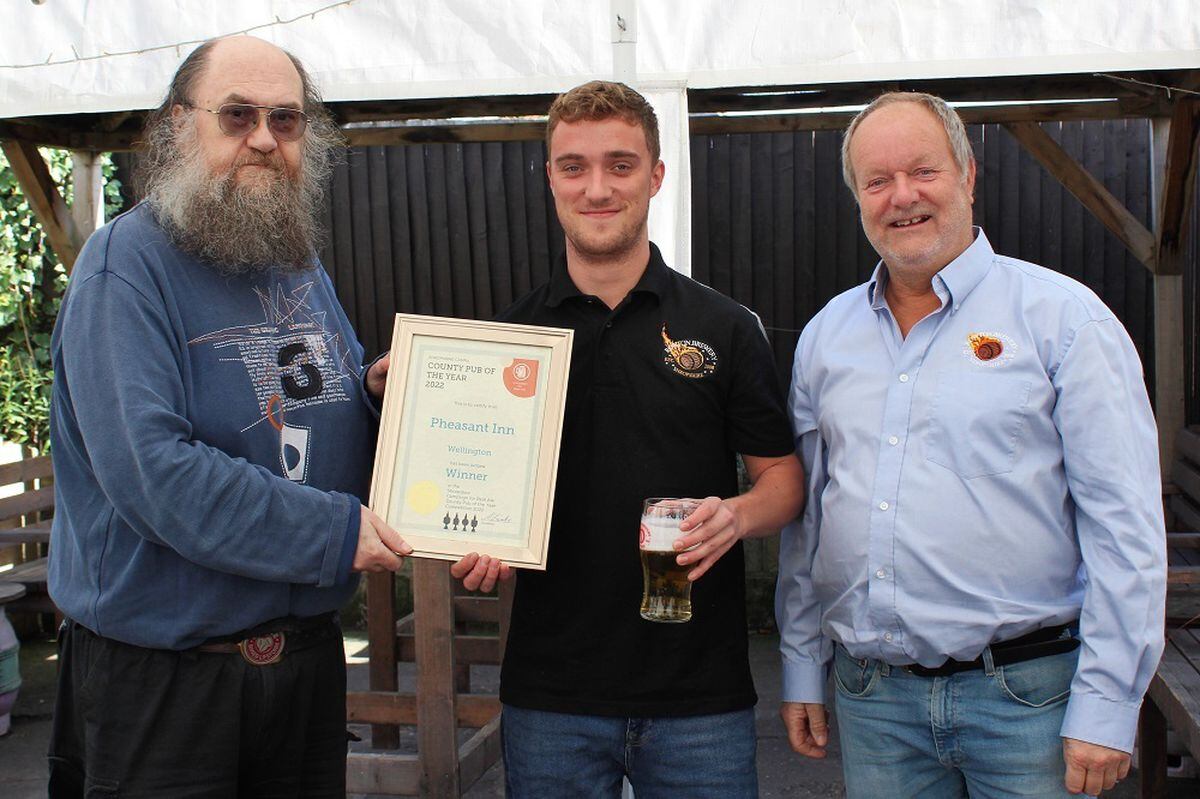 From left, CAMRA's Adrian Zawierka, with the pub's Peter and Jim Preston
