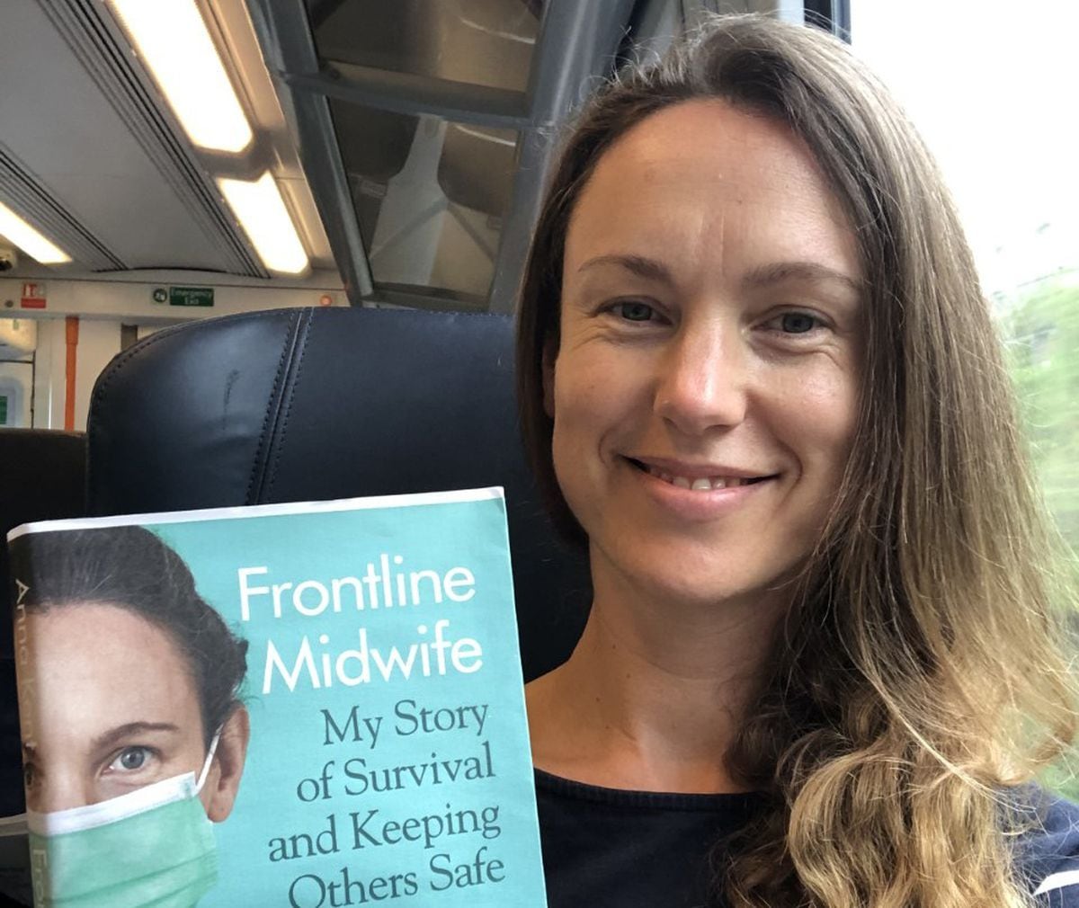 Anna with her new book Frontline Midwife