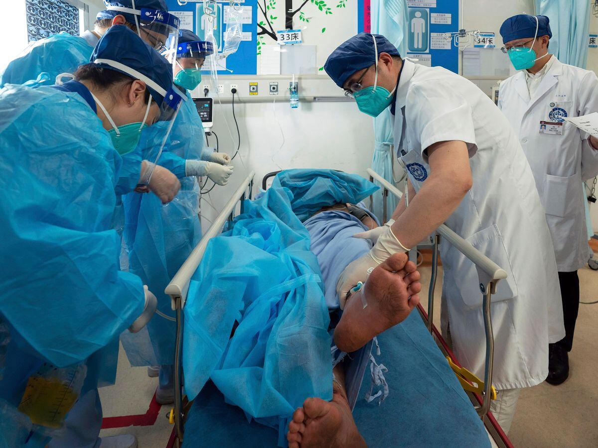 Medics check the condition of Gan Yu