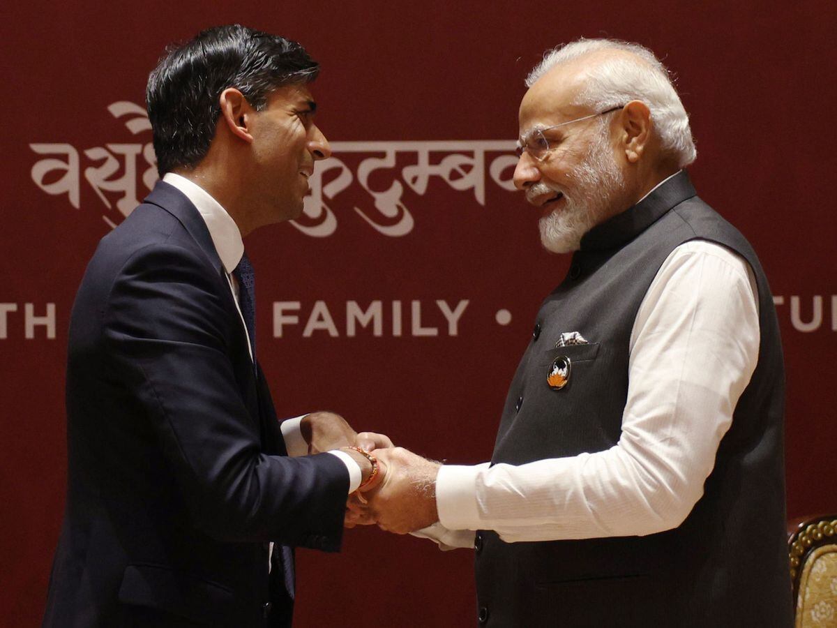 Prime Minister Rishi Sunak shakes hands with Indian counterpart Narendra Modi
