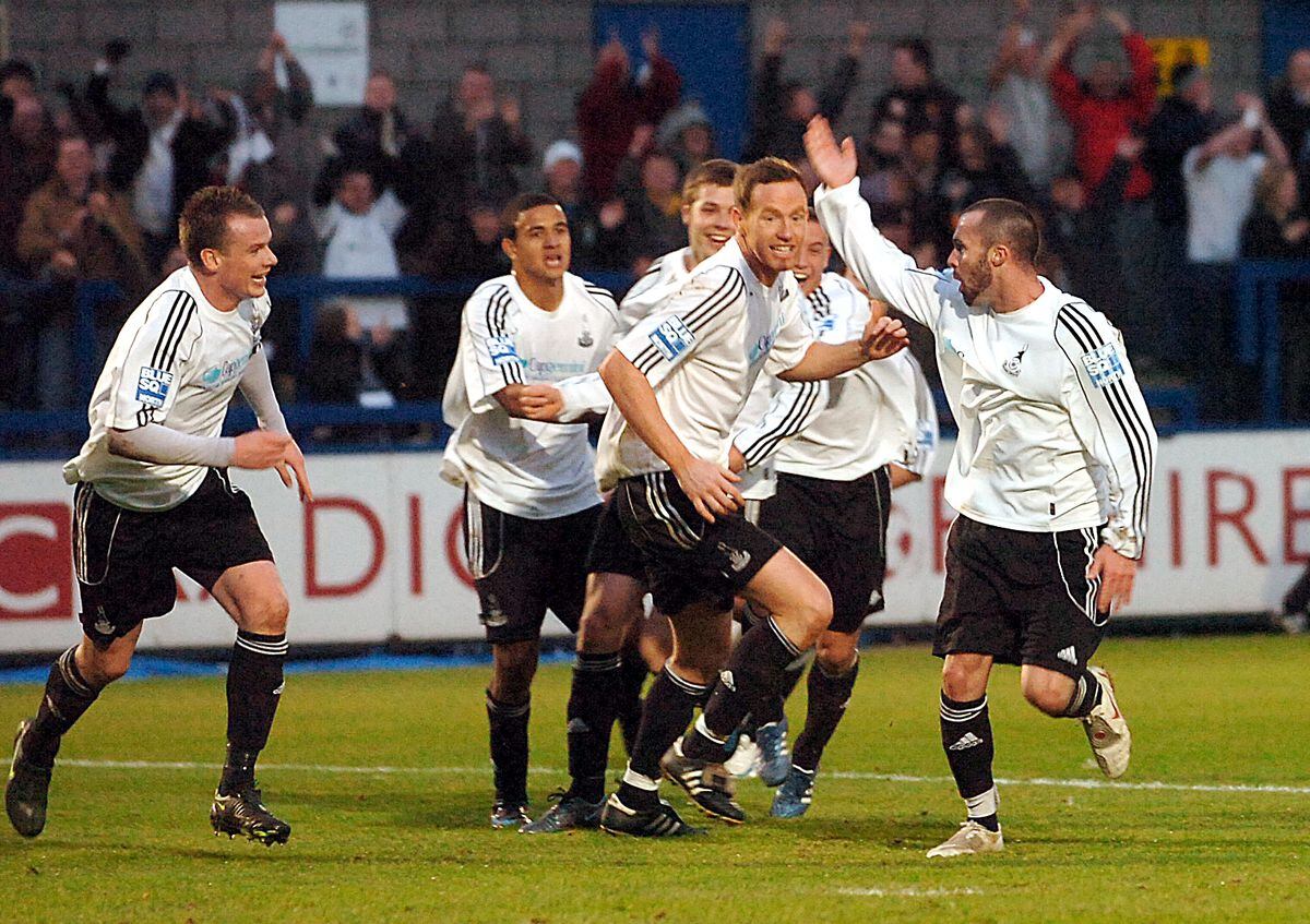 Telford's Jon Adams, right, celebrates with team mates after he scored Telford's 1st goal against Southend in the FA Cup. (Andy Cunningham)