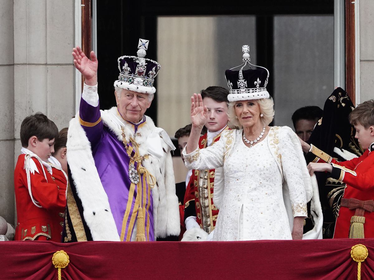 The King and Queen on the balcony of Buckingham Palace, London, following the coronation (Jordan Pettitt/PA)