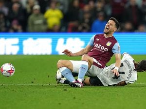               Aston Villa's Alex Moreno is tackled by Fulham's Bobby Decordova-Reid