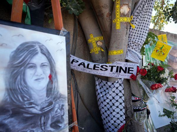 A memorial at the site where Al-Jazeera journalist Shireen Abu Akleh was shot and killed