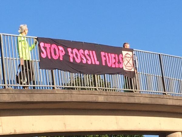 Protesters with banners over the M54