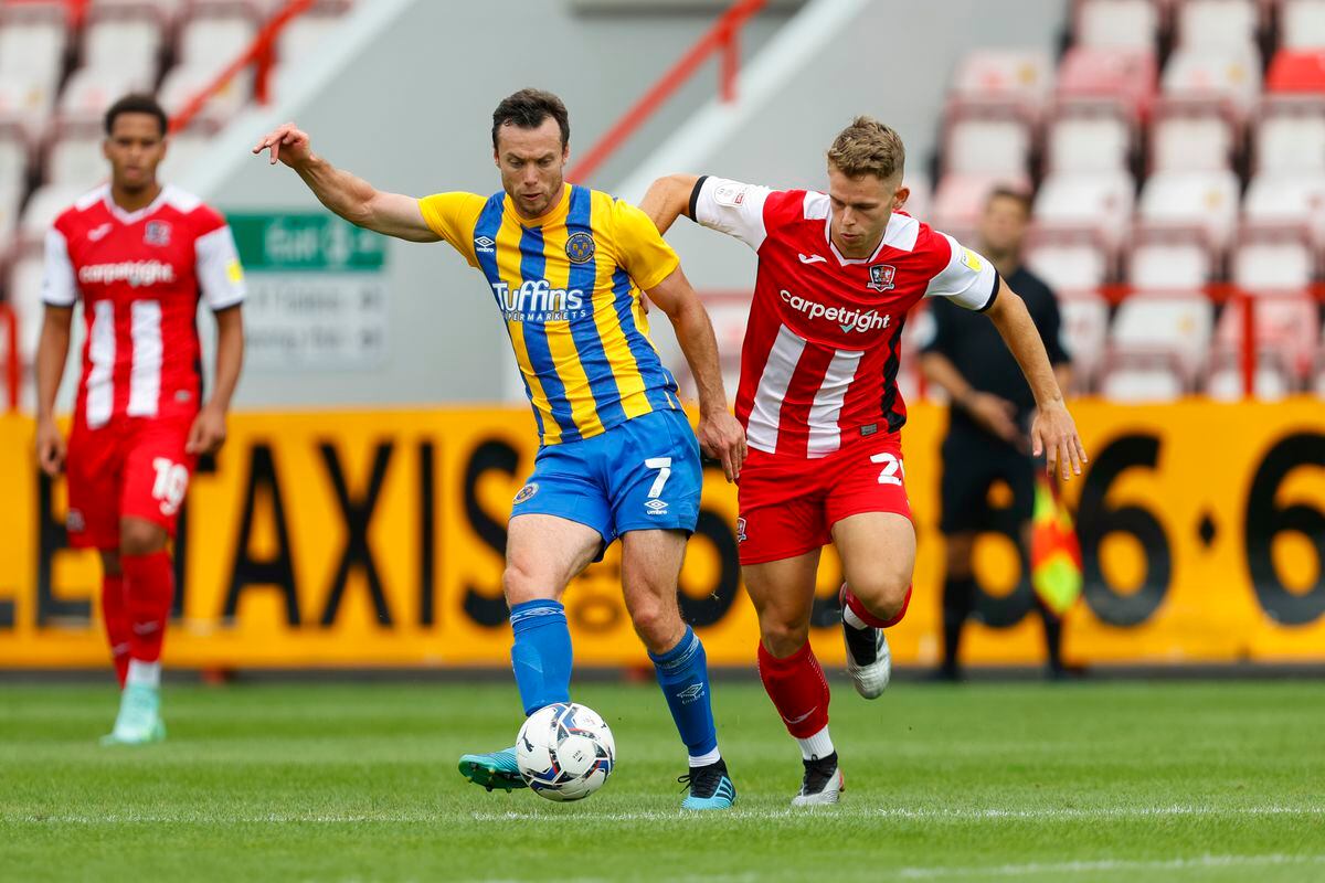 Shaun Whalley of Shrewsbury Town and Harry Kite of Exeter City. (AMA)