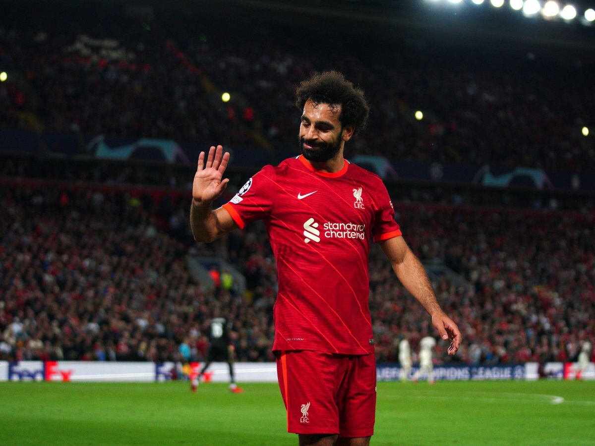 Liverpool’s Mohamed Salah waves