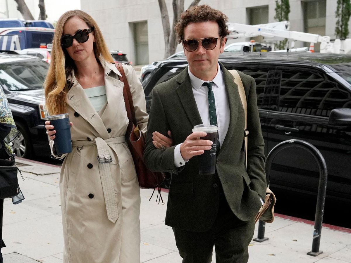Danny Masterson and his wife Bijou Phillips arrive at court