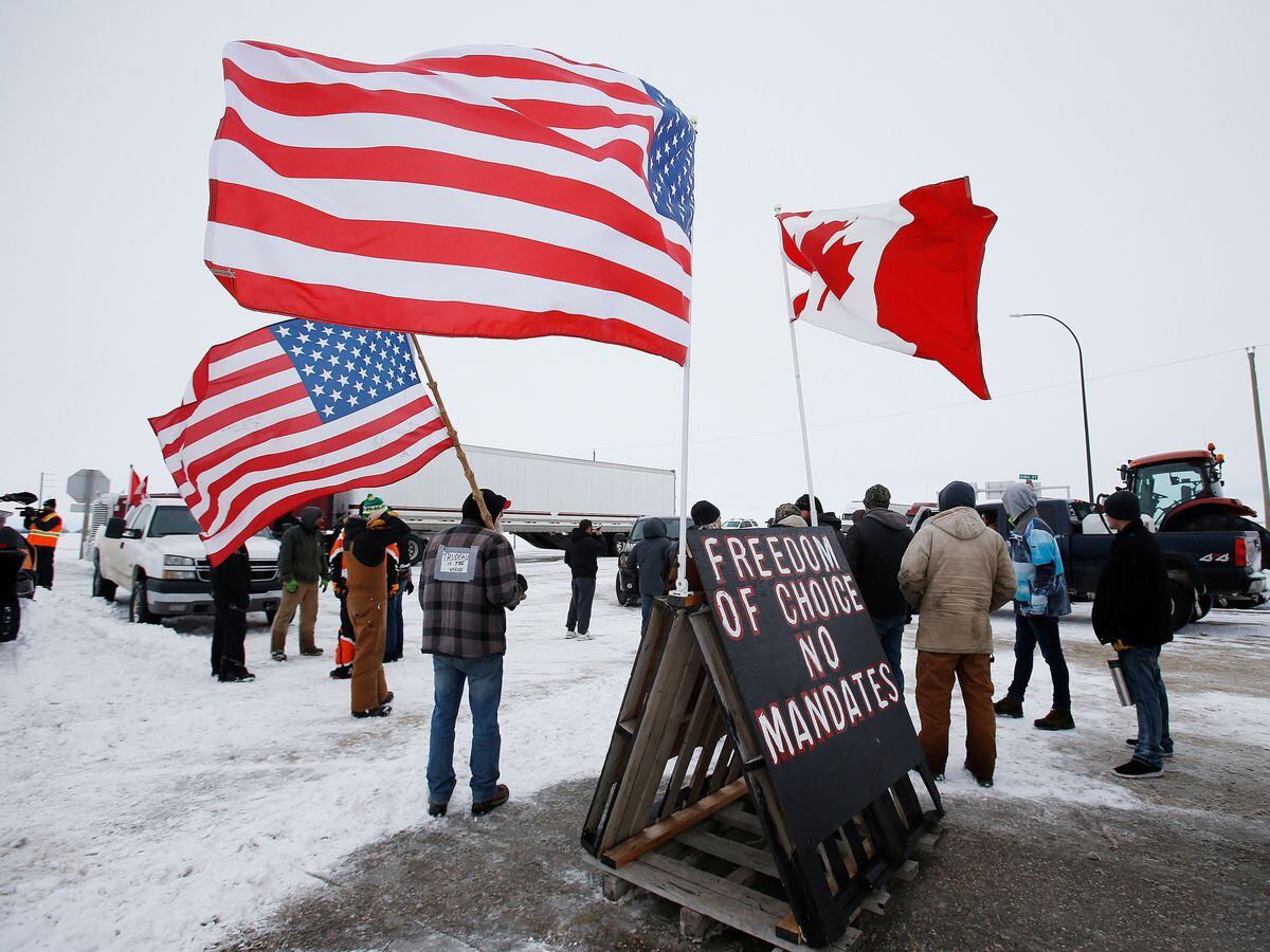 People block highway 75 with heavy vehicles and farm equipment and access to the Canada-United States border crossing at Emerson, Manitoba