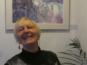 Maggie Humphry and her artwork in Cafe Eighty-Six'd