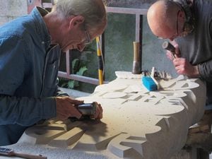 Artist John Neilson, assisted by Trevor Clarke, put the finishing touches to the stone carving for the Jebb Garden ( Picture: Bob Richards)