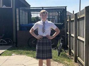 Oliver in his school skirt