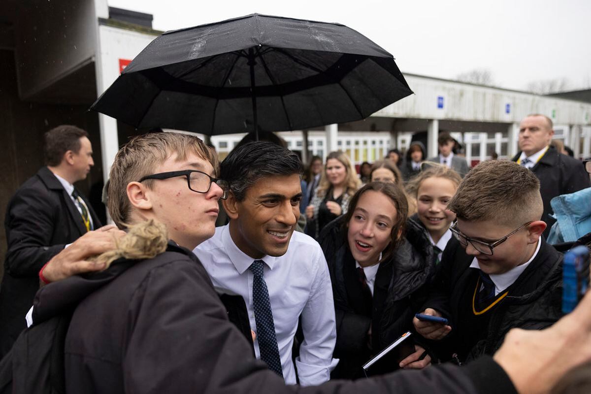 Rishi Sunak stopped for photos with pupils at the school