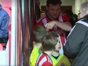 Soon-to-be-wed Nick Goff, 38, joined a group of children in leading out Brentford on Saturday.