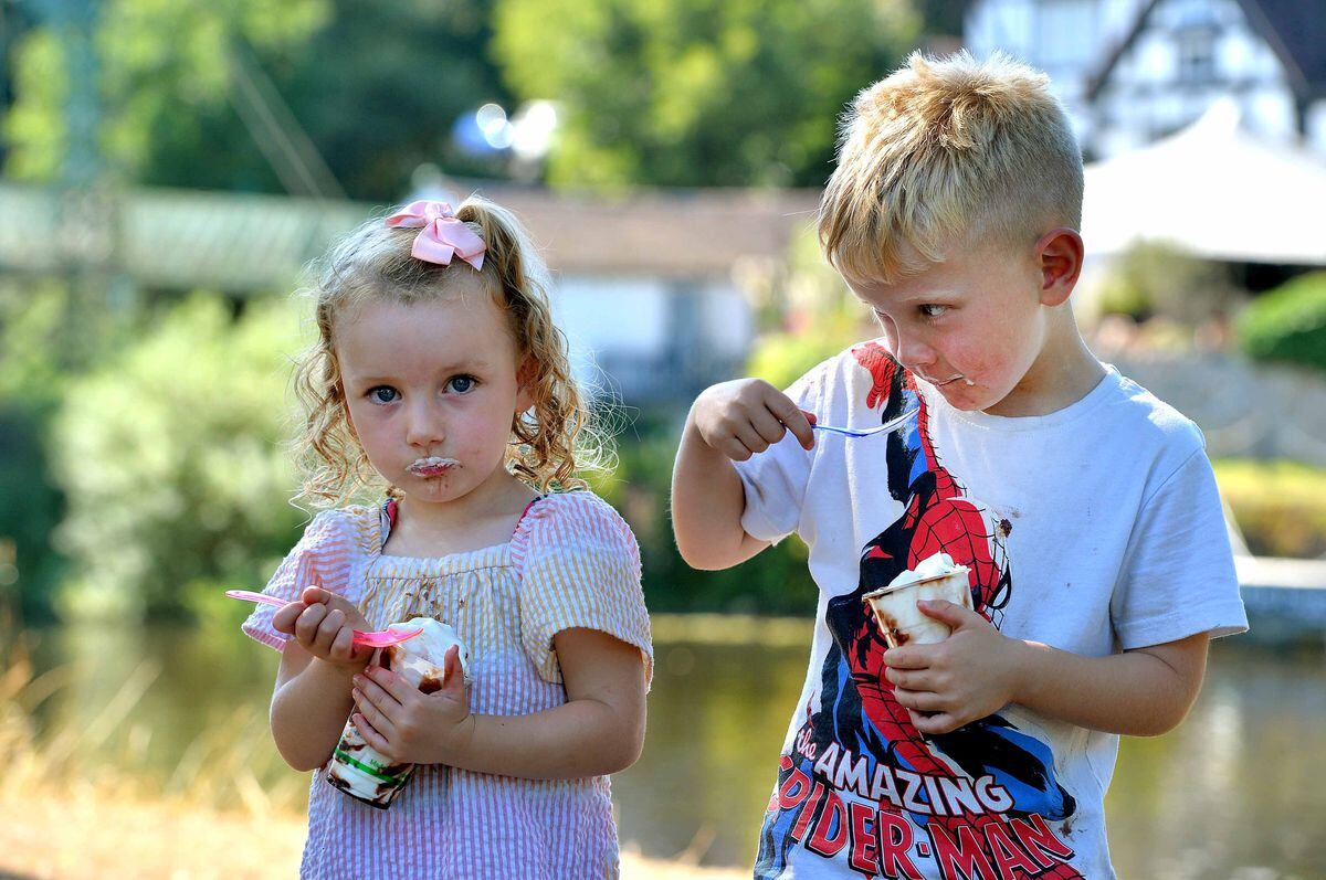 Maya and Travis Harrison enjoying an ice cream in the sun
