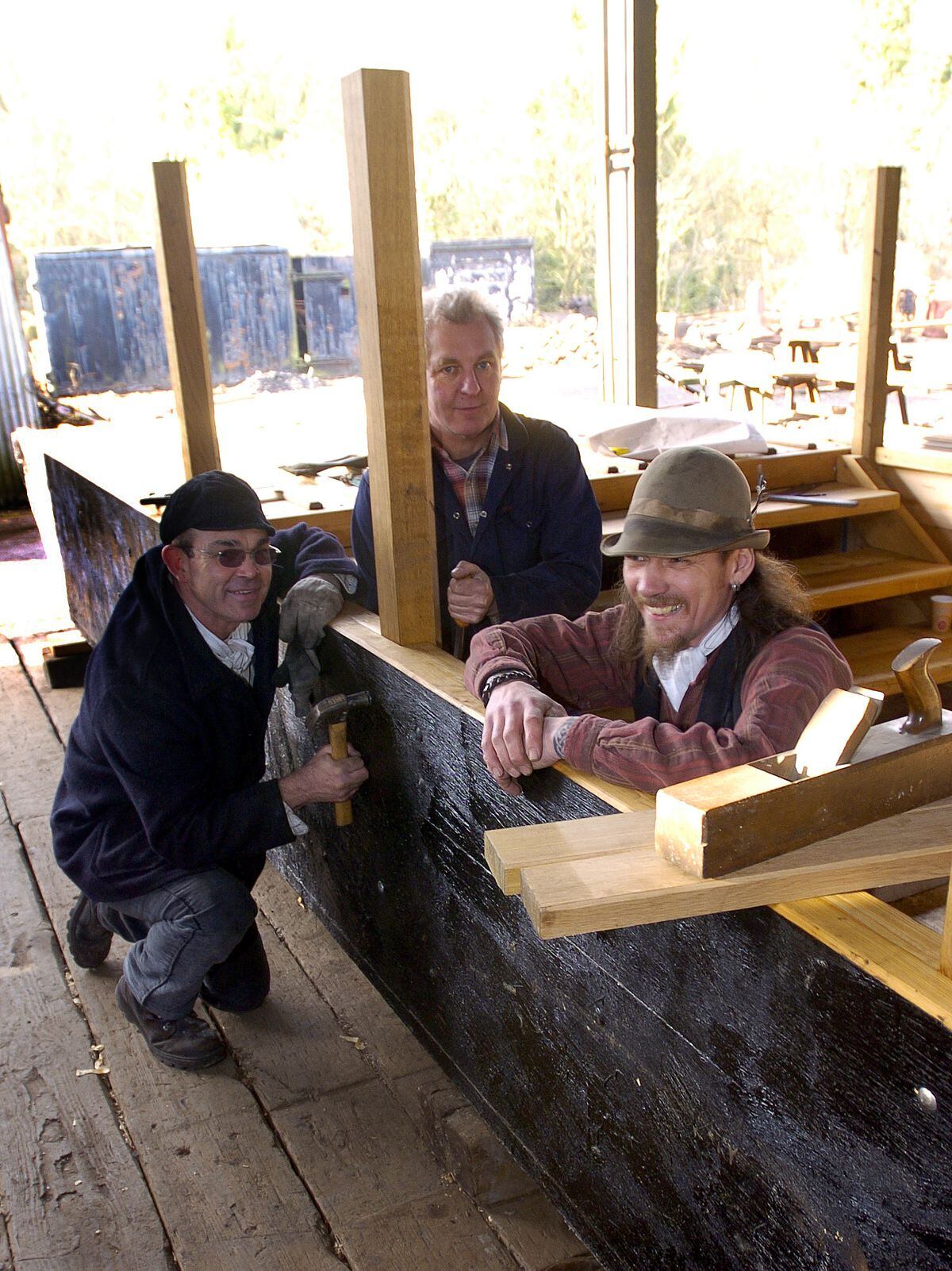 Tom Jones, Peter Stoddad and Mark Deakin-Segal at work on the new Hampton Loade ferry being built at the Blist Hill Museum.