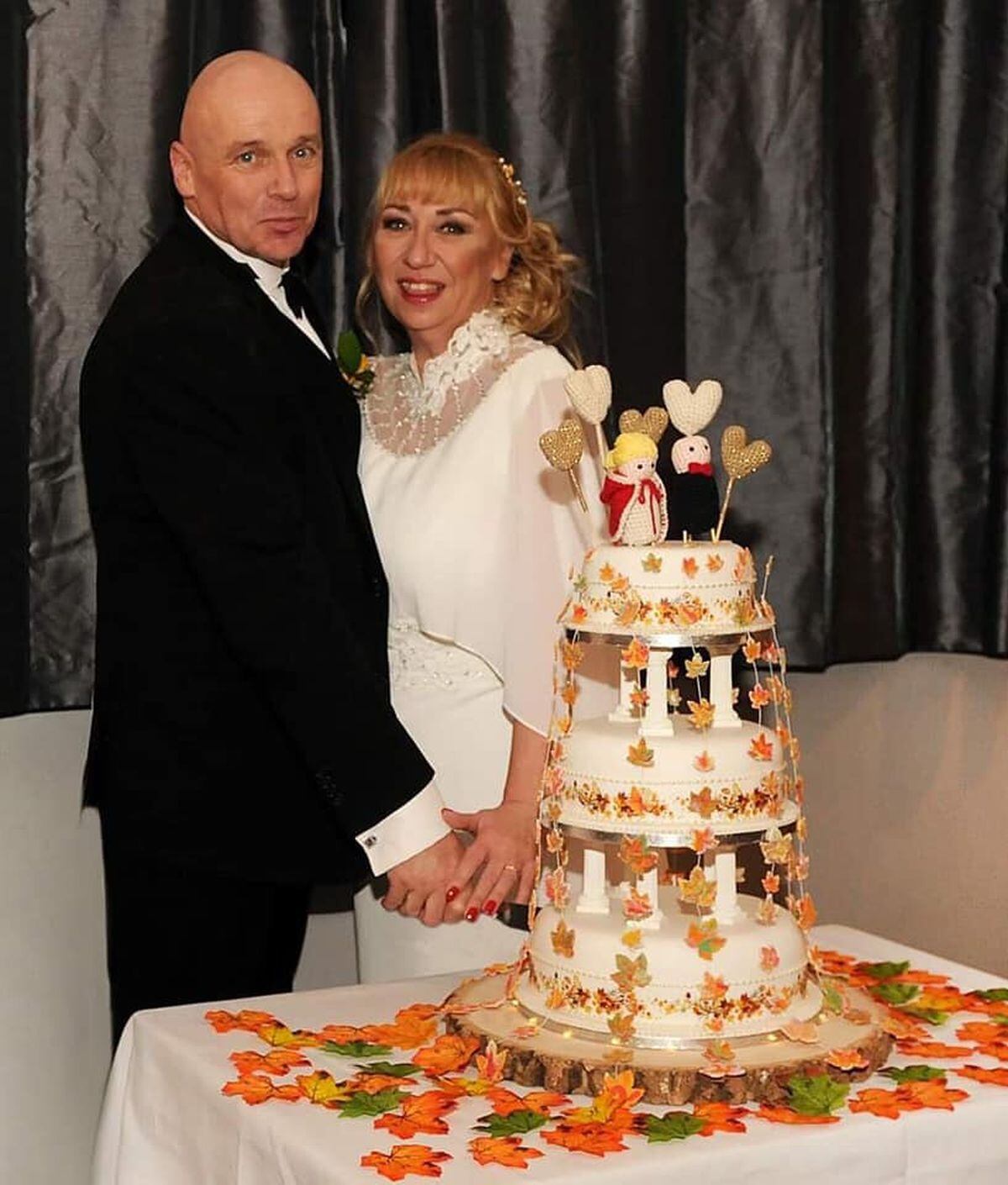 The happy couple with their wedding cake. Photo: Amanda Reynolds 