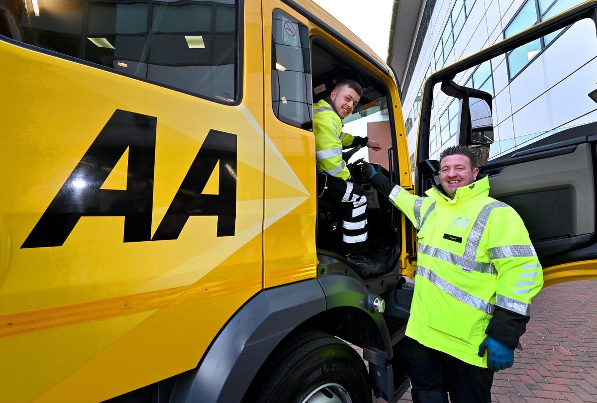 Apprentice Nathan Watson behind the wheel of a £135,000 recovery vehicle with mentor Shaun Baugh at the AA's new training academy in Oldbury
