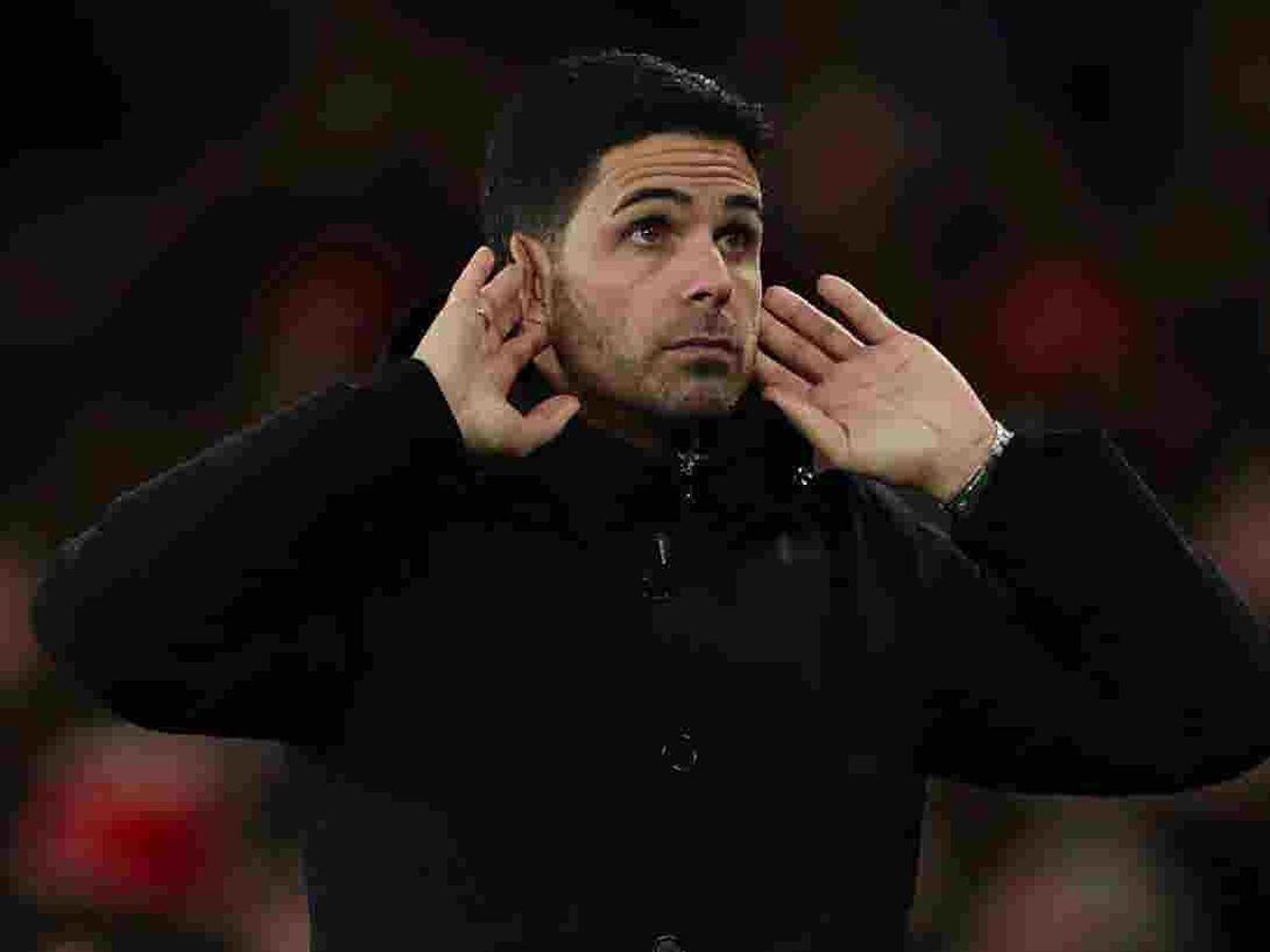 Mikel Arteta cups his ears on the touchline