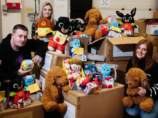 LAST COPYRIGHT SHROPSHIRE STAR JAMIE RICKETTS 09/12/2022 - Shropshire Star Toy Appeal in connection with Shropshire-based brewery Joule's. In Picture: Golden Bear Products in Telford will be donating a large amount of toys the Shropshire Star Appeal L>R: Tom Fenn, Siskia Hamilton and Niamh Beer.