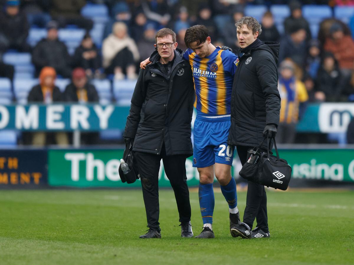 Tom Bayliss of Shrewsbury Town leaves the pitch with an injury (AMA)