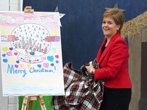 Nicola Sturgeon unveiling her Christmas card