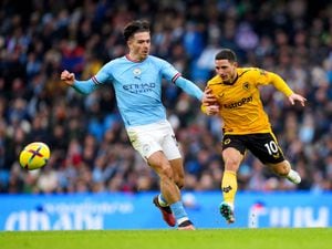 Manchester City's Jack Grealish (left) and Wolverhampton Wanderers' Daniel Podence 